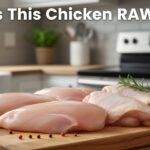 raw chicken breast and thighs on cutting board in kitchen showing fresh uncooked poultry